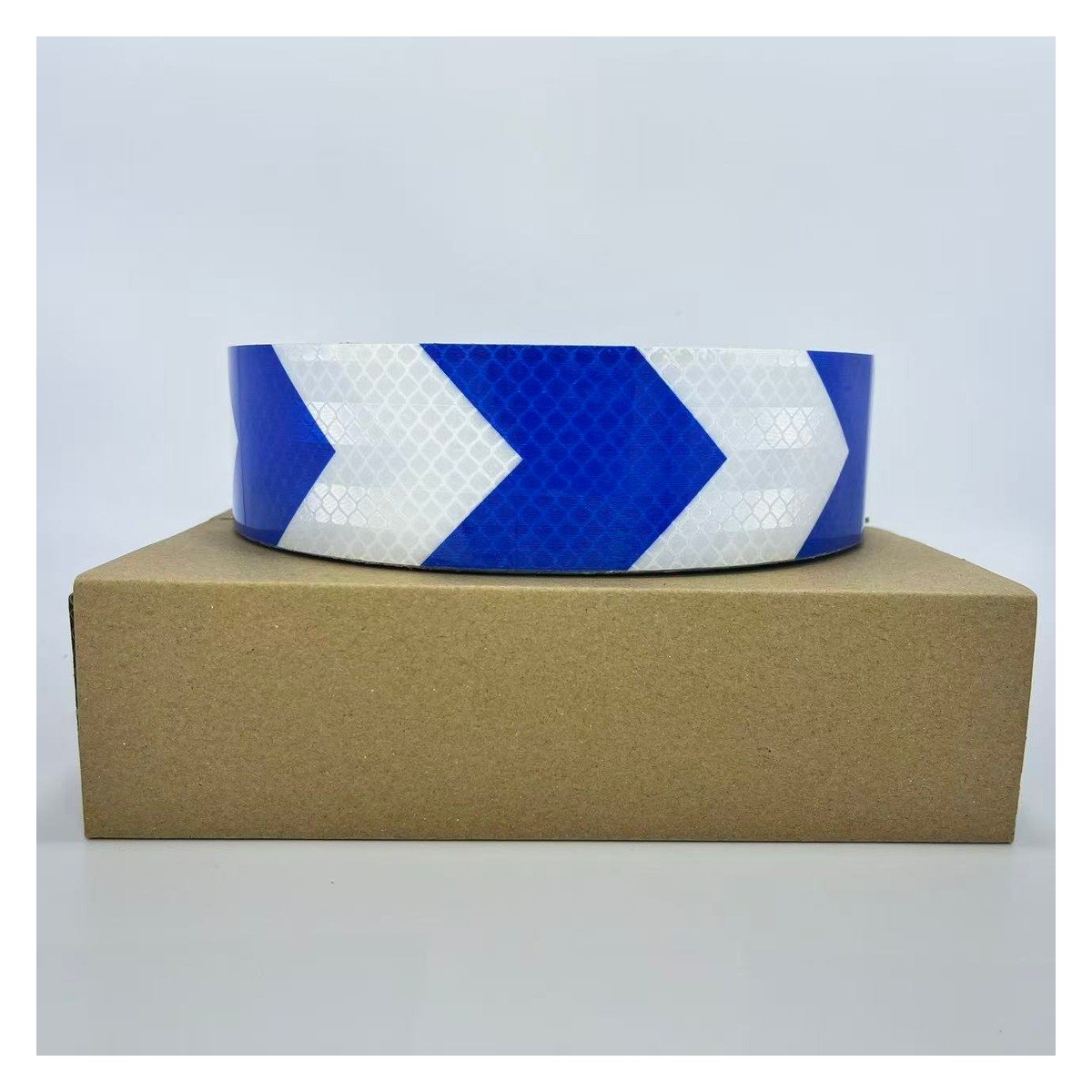 Blue and white arrow reflective tape roll