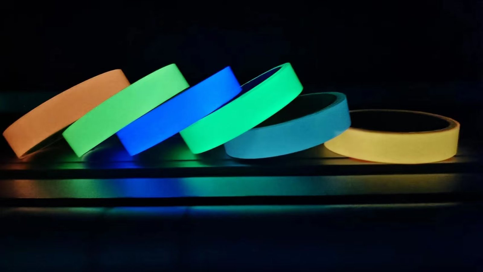 Photoluminescent glow tape rolls