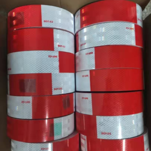 Red and white DOT-C2 reflective tape rolls packed in a carton