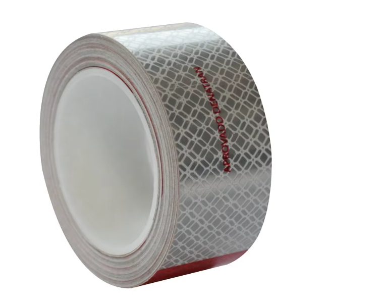 Metallized red and white reflective tape roll side view