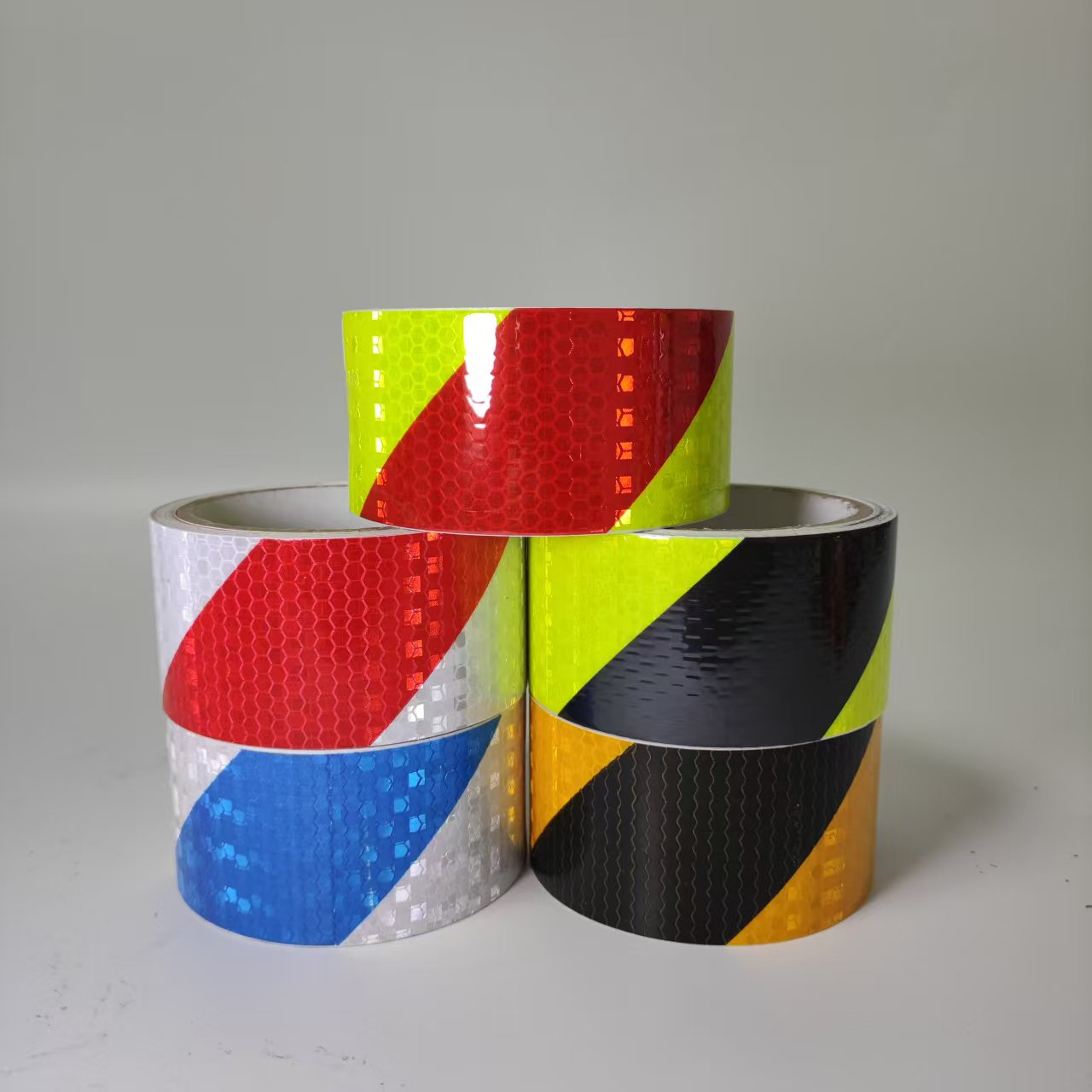 Group of multicolor PVC diagonal stripe reflective tape rolls