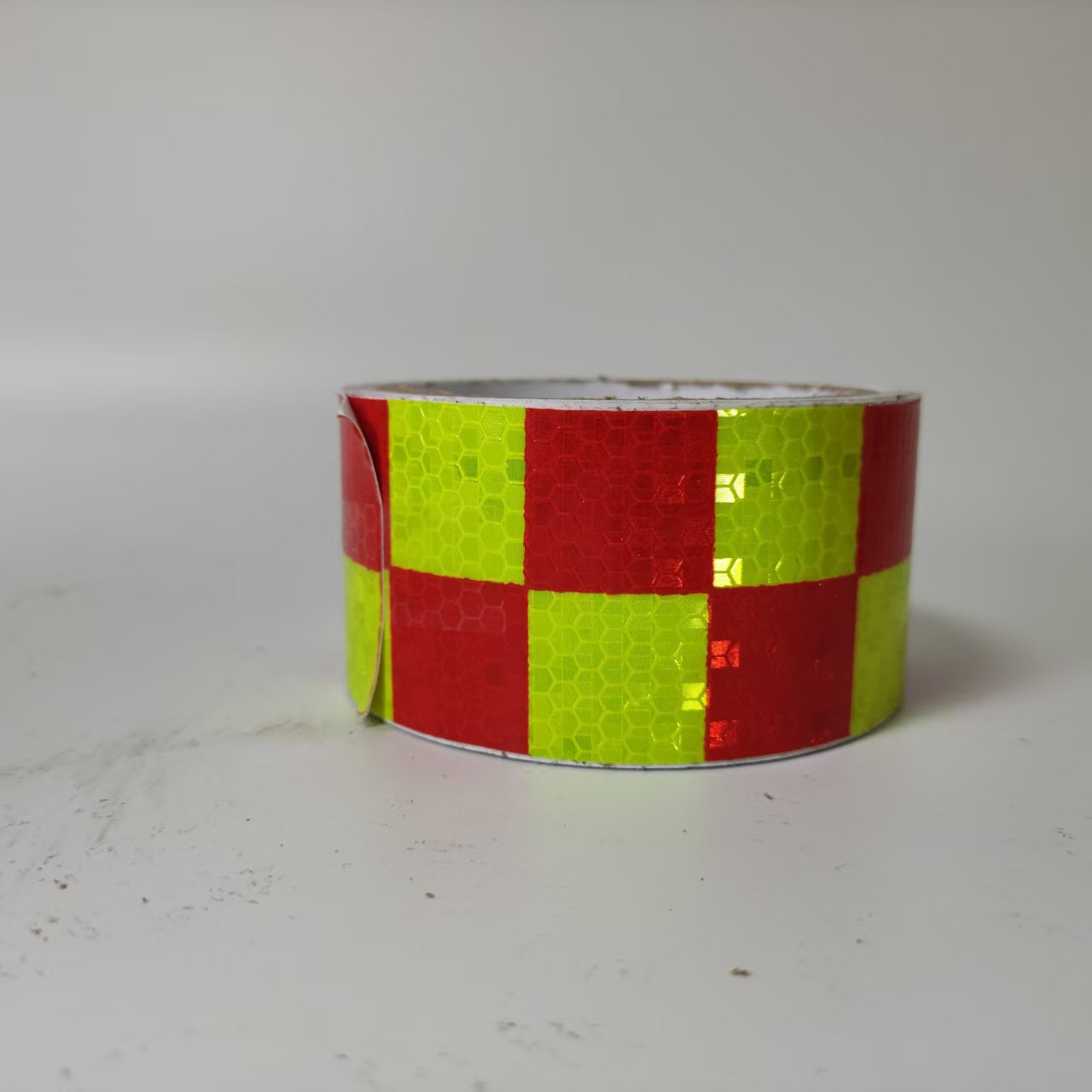 Red and fluorescent yellow checkerboard reflective tape roll