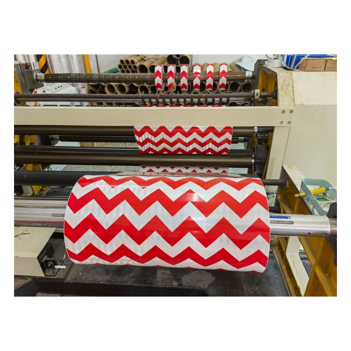 Red and white arrow reflective tape on the production line