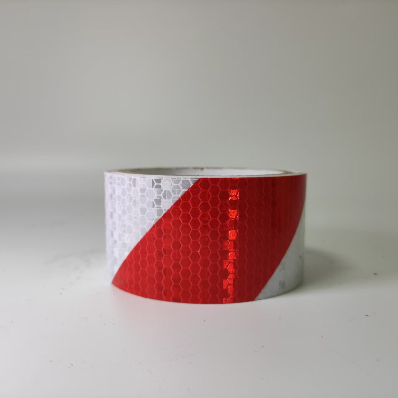 Red and white PVC diagonal stripe reflective warning tape roll