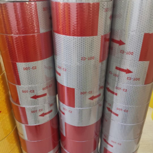 Stacks of red and white DOT-C2 reflective tape rolls