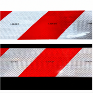 Red and white prismatic reflective tape under different lighting