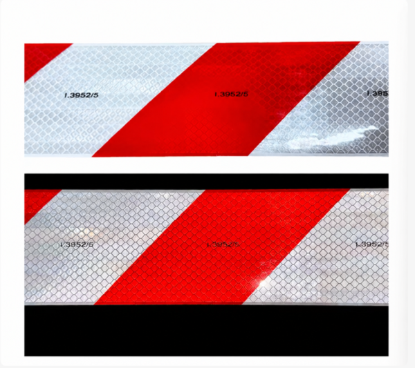 Red and white prismatic reflective tape under different lighting
