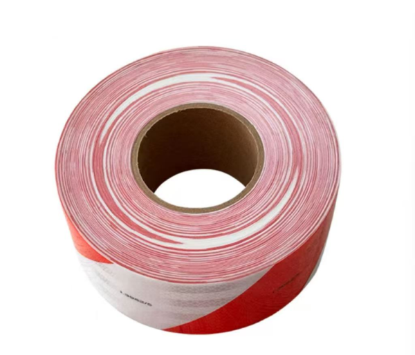 Red and white prismatic reflective tape roll top view