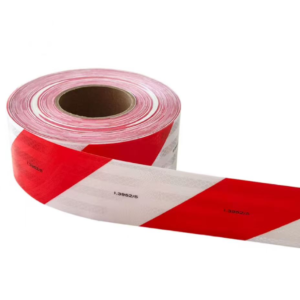 Red and white prismatic reflective tape partially unrolled