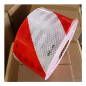 Diagonal red and white reflective tape pattern close-up