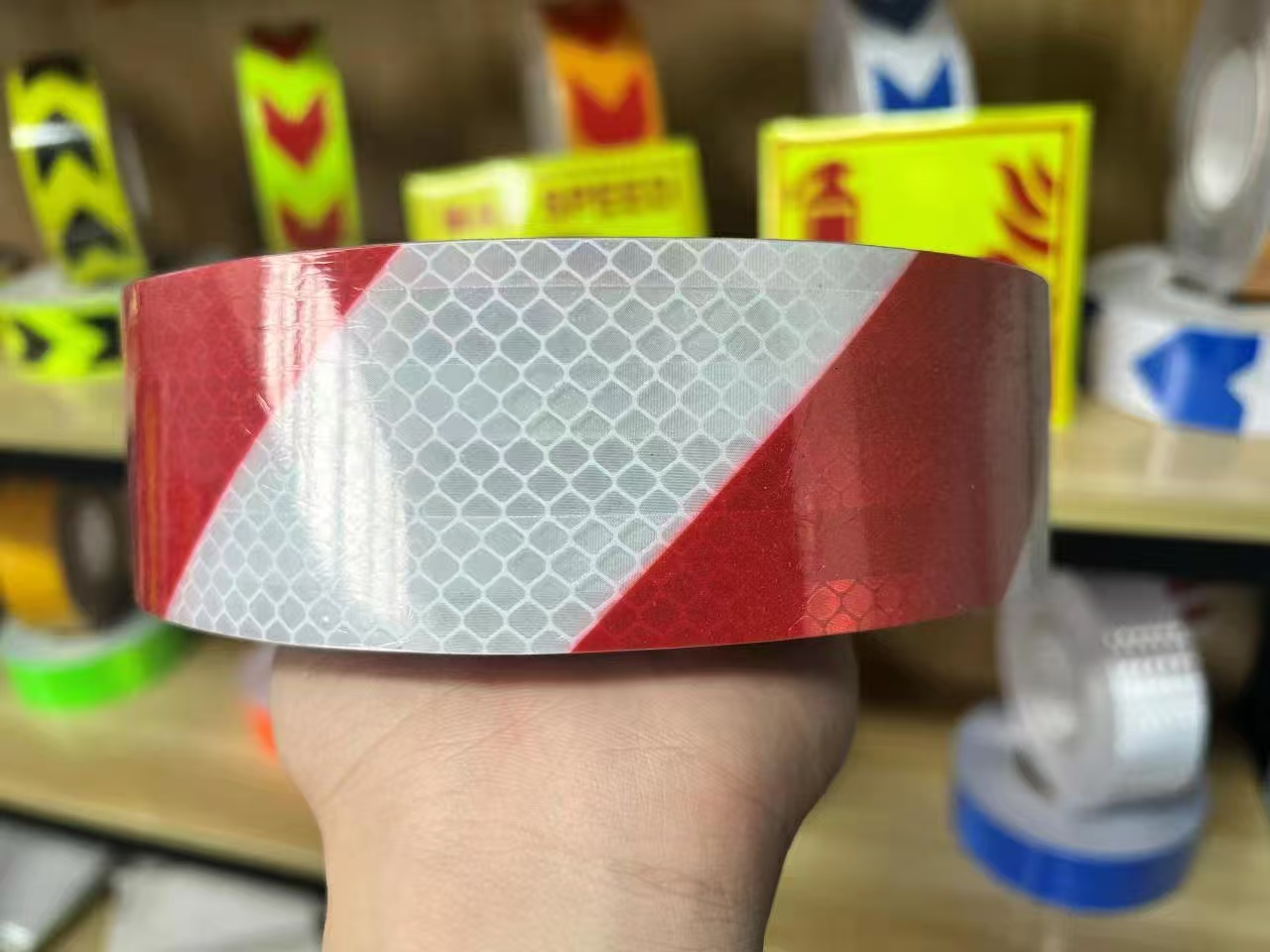 Red and white slant stripe reflective tape close-up