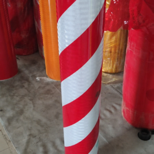 Red and white slant stripe reflective warning tape rolls