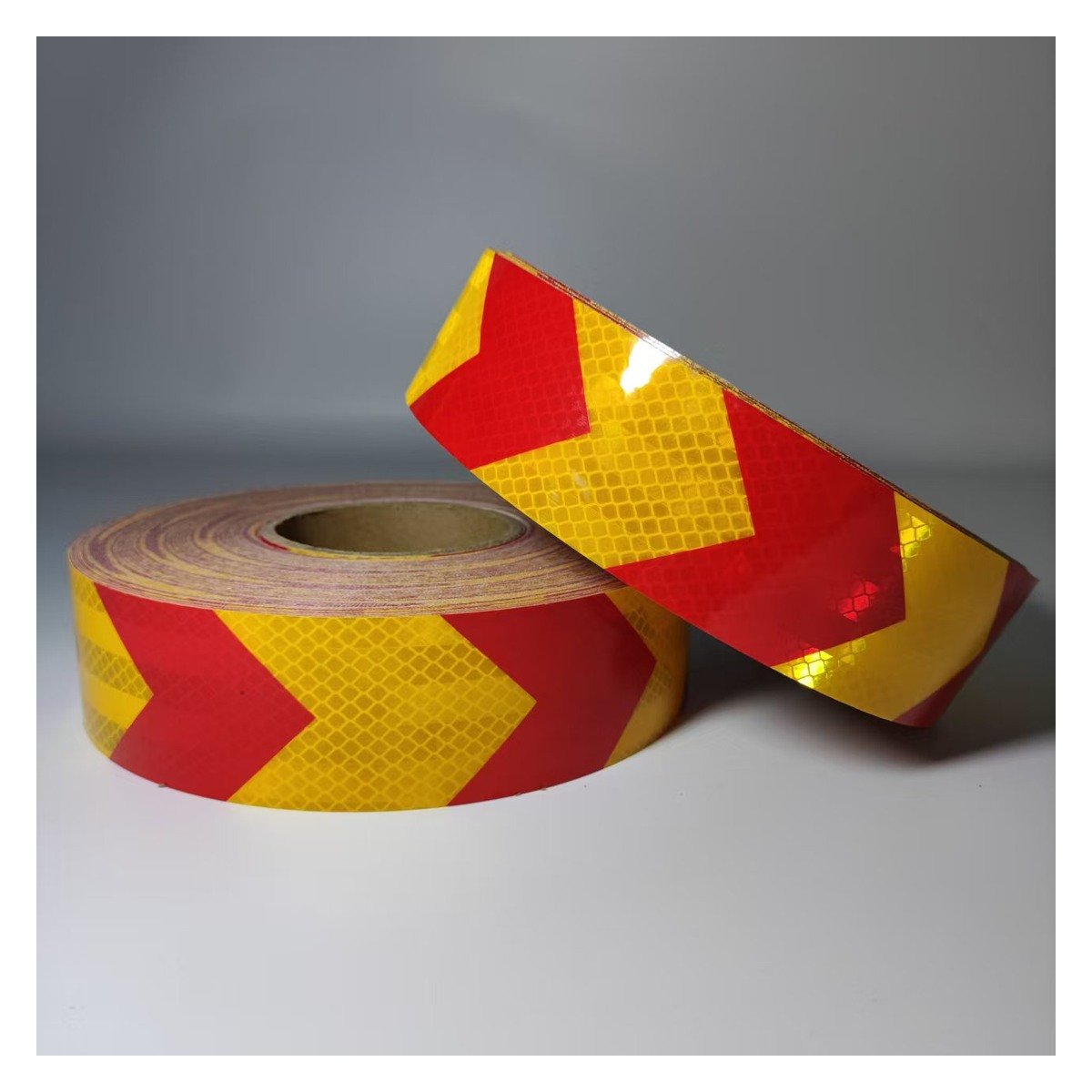 Red and yellow arrow reflective tape rolls