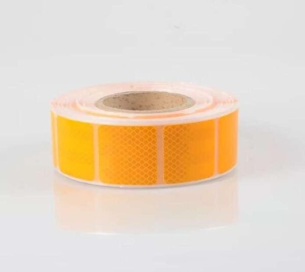 Yellow segmented reflective tape on a release liner