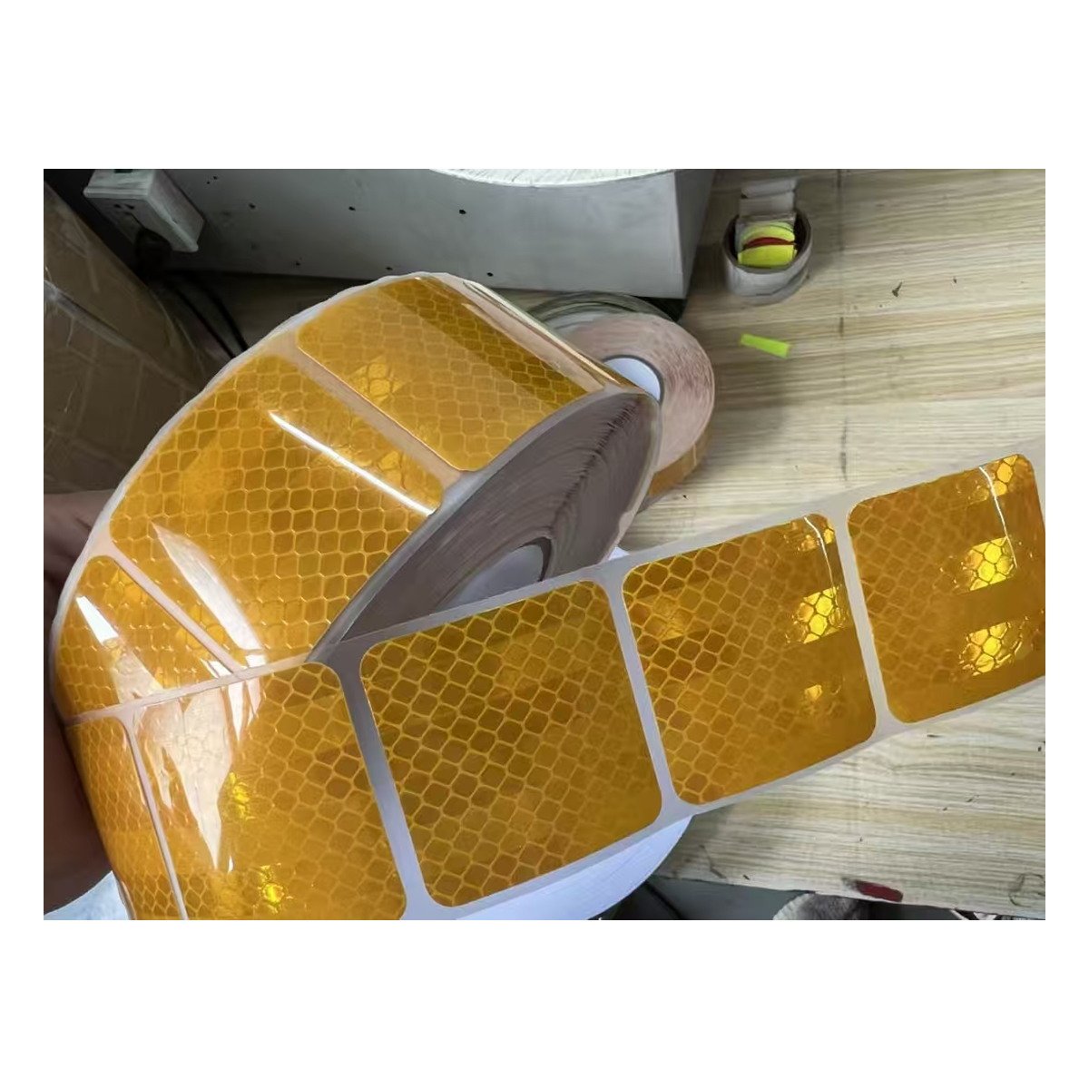 Yellow segmented reflective tape roll and release liner detail