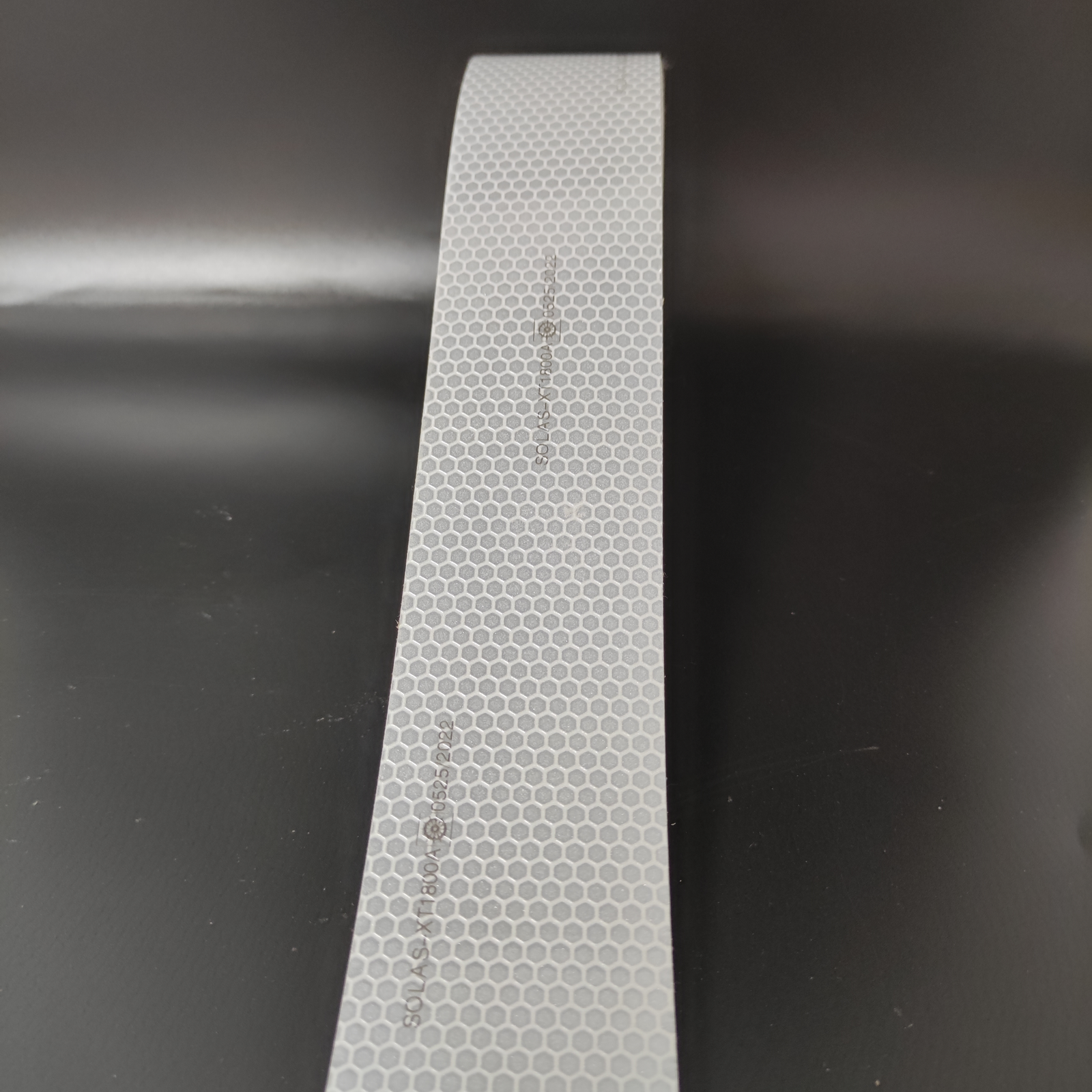 Honeycomb surface detail of silver reflective tape