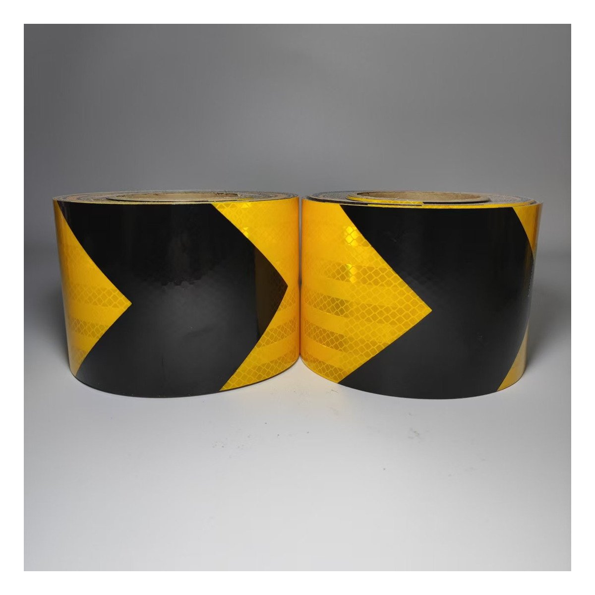 Yellow and black arrow reflective tape rolls
