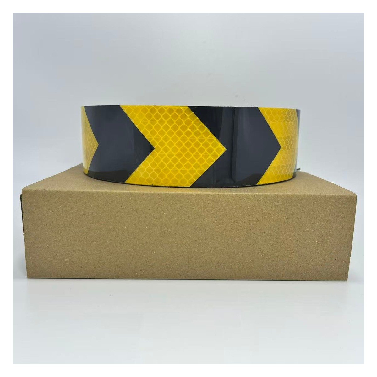 Yellow and black arrow reflective tape roll