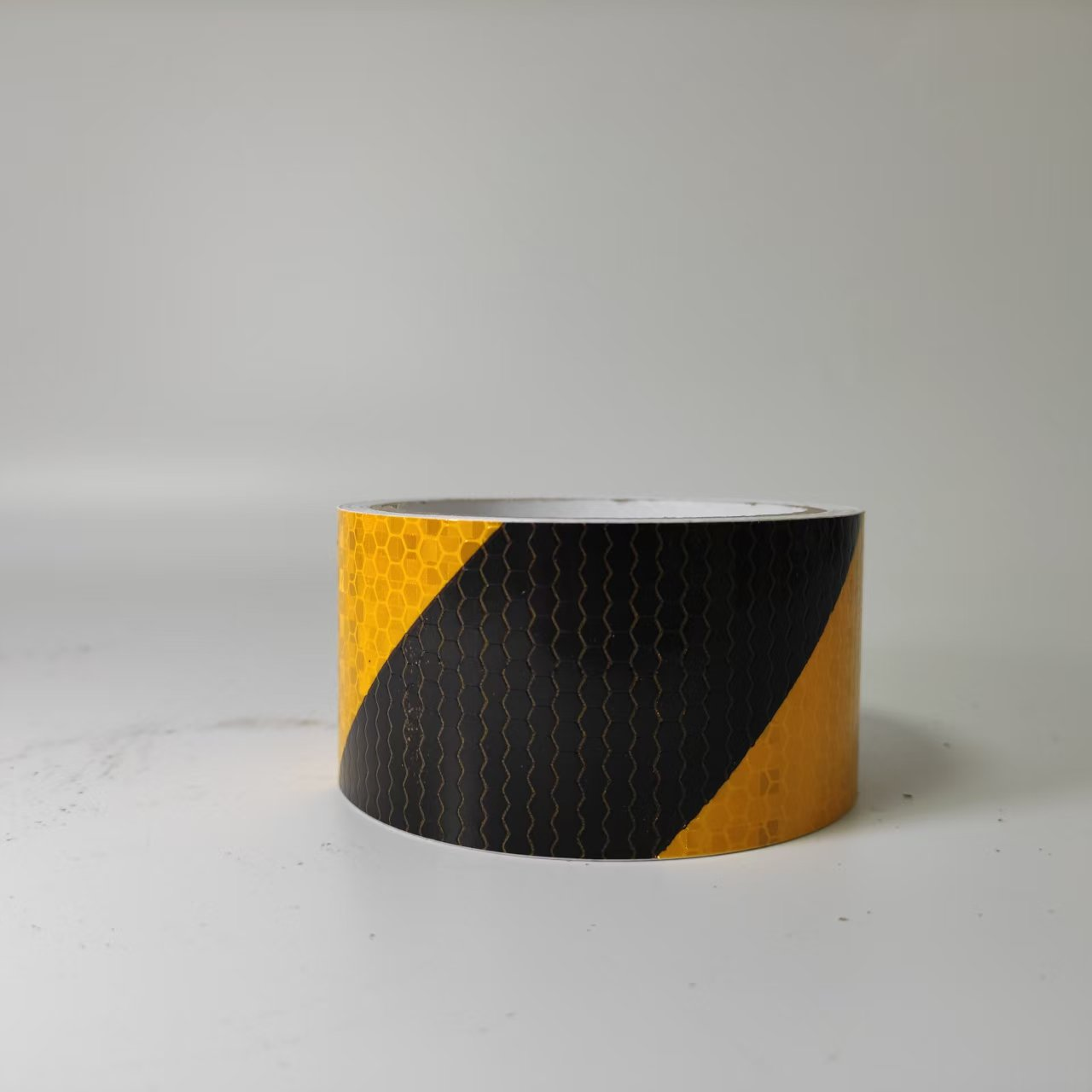 Yellow and black PVC diagonal stripe reflective tape roll