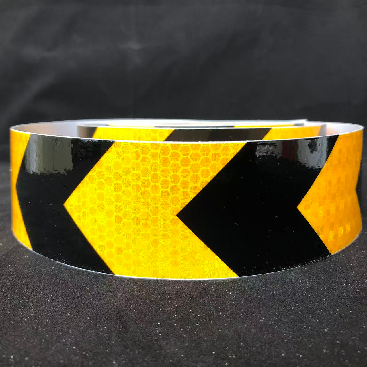 Yellow and black PVC arrow reflective tape roll