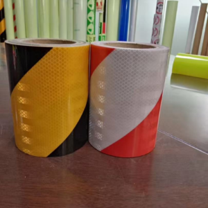 Yellow-black and red-white reflective warning tape rolls