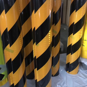 Yellow and black reflective warning tape rolls