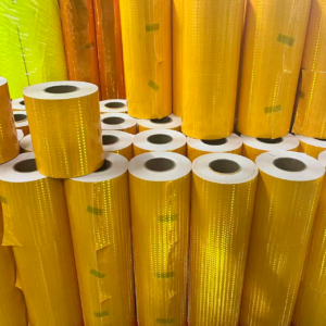 Yellow prismatic reflective tape rolls in production stock