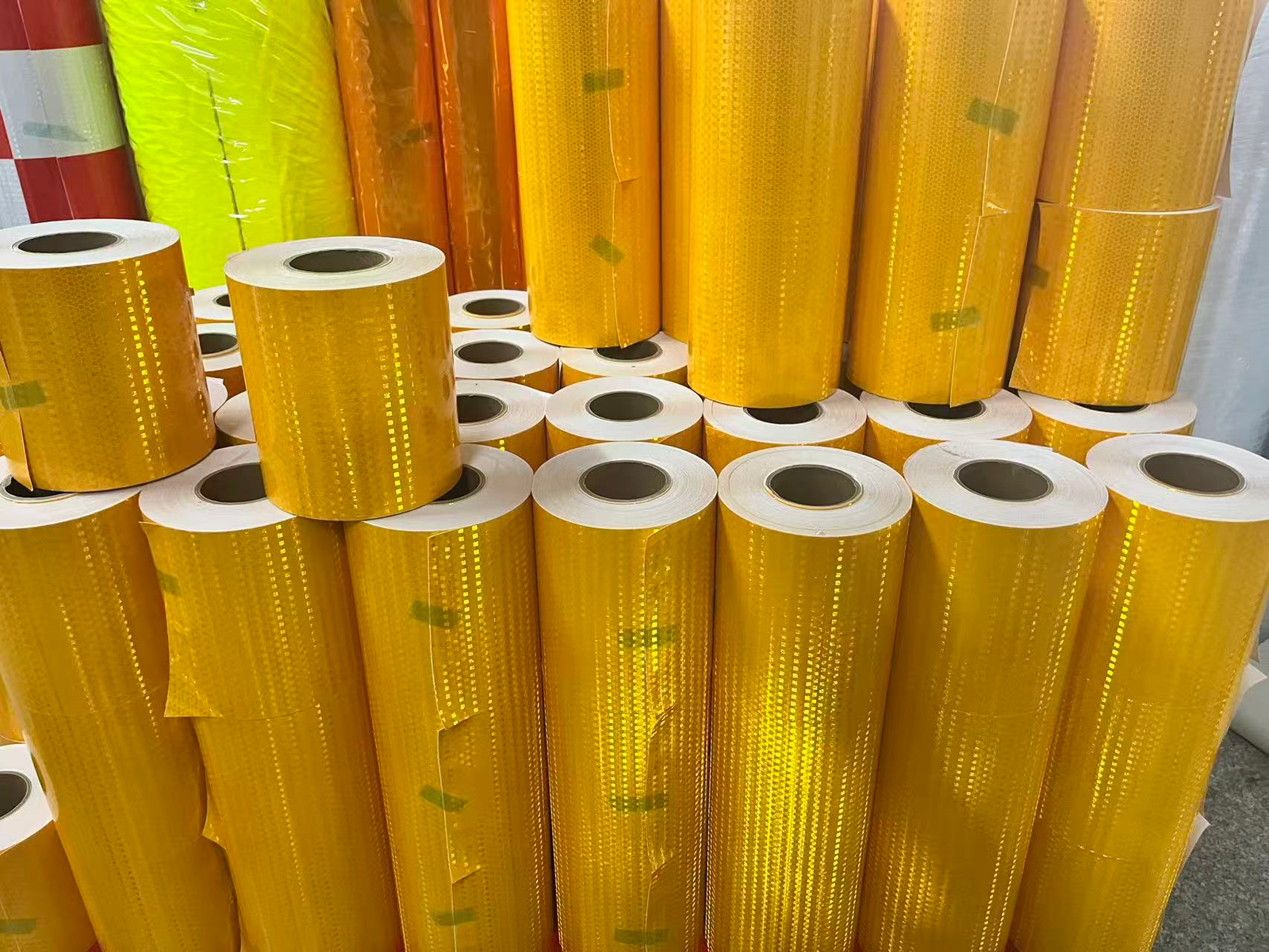 Yellow prismatic reflective tape rolls in production stock