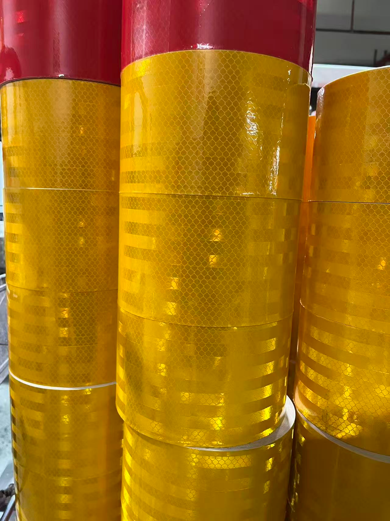 Yellow reflective warning tape rolls