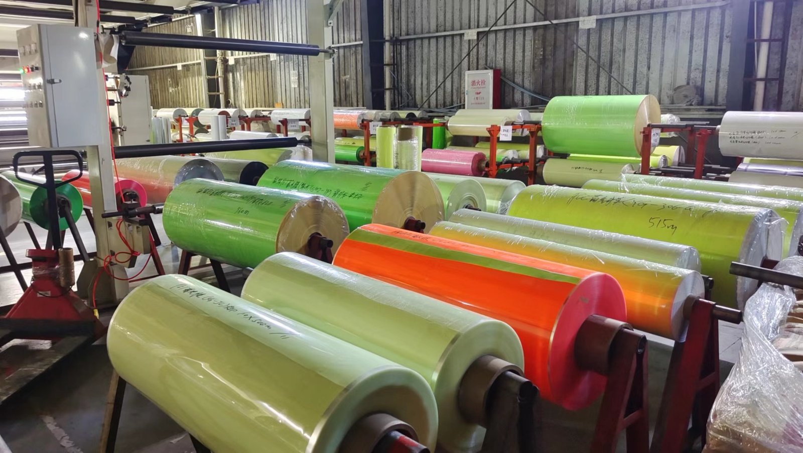 Colored photoluminescent film rolls stored on workshop racks