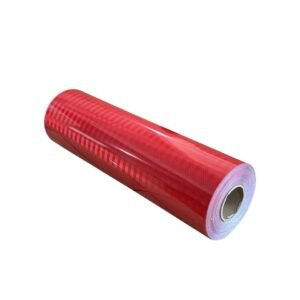 Red reflective film roll with white backing visible at the edge