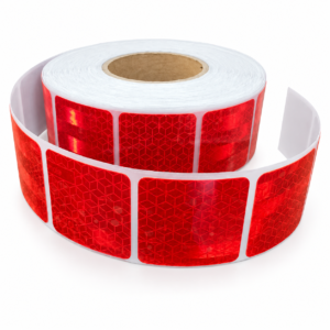 Red elephant-pattern reflective tape partially unrolled on a white background
