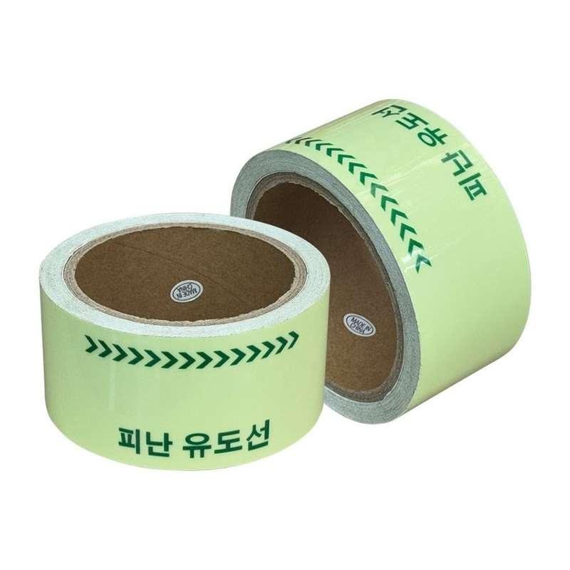 Photoluminescent tape rolls with green arrows and Korean exit guidance wording