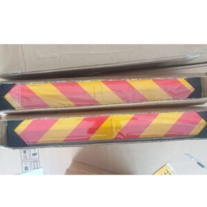 Paired red and yellow reflective rear marker plates packed in long cartons