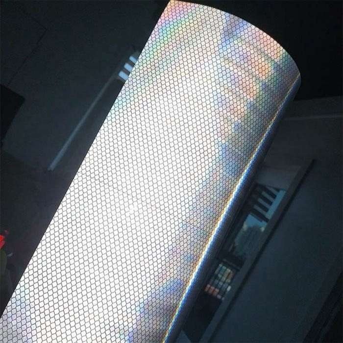 White prismatic reflective film close-up showing its surface pattern under illumination