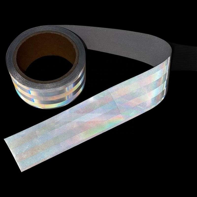 Silver sew-on reflective webbing roll under directed illumination