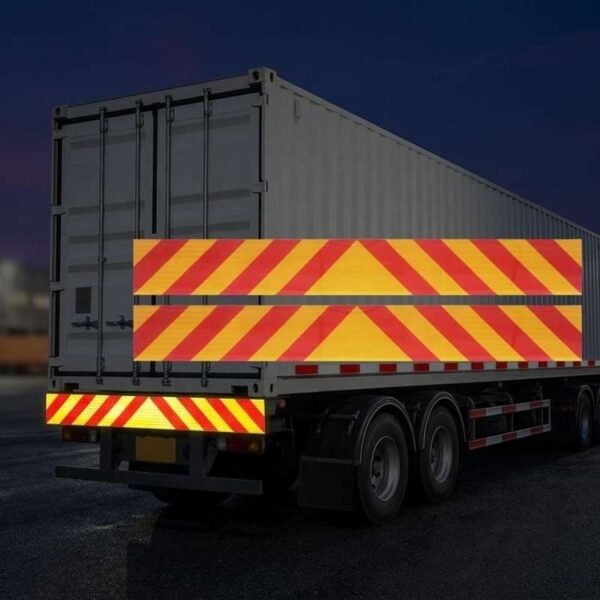 Illustrative red and yellow chevron bumper marking on a truck