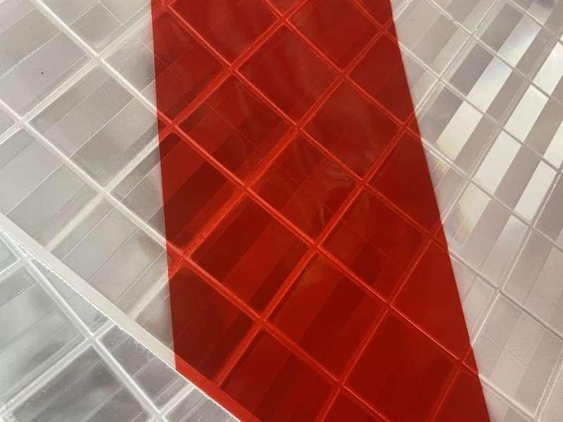 Close-up of red and white prismatic tail lift flag surface