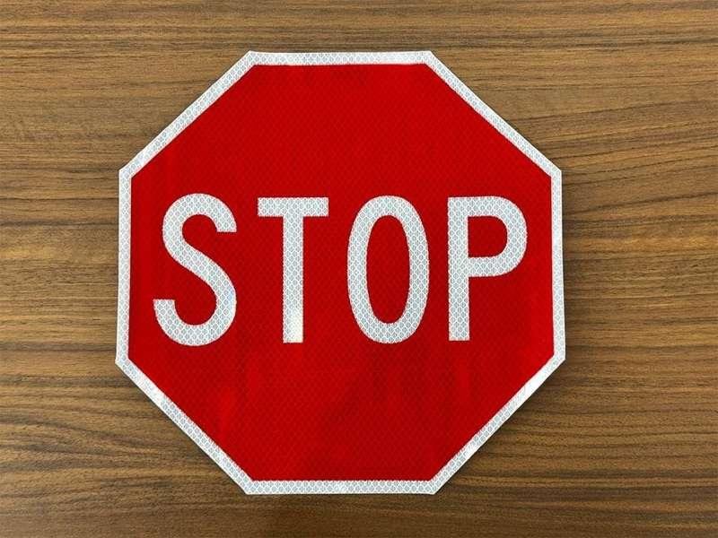 Octagonal red and white reflective STOP sign sticker