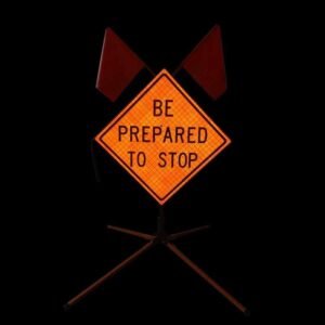 BE PREPARED TO STOP sign reflecting directed light in dark conditions