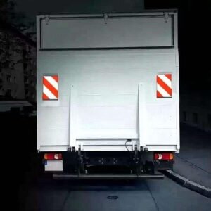 Red and white tail lift marking flags illustrated on the rear of a delivery truck