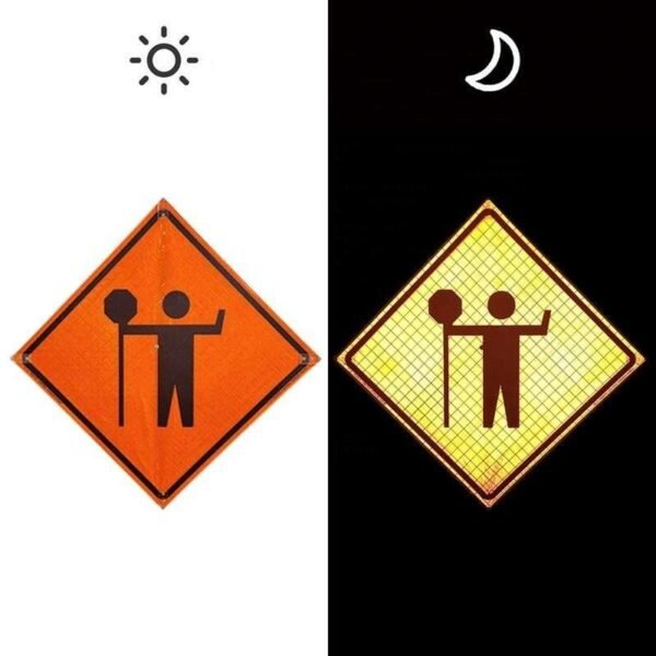 Flagger symbol sign shown in daytime and under directed light