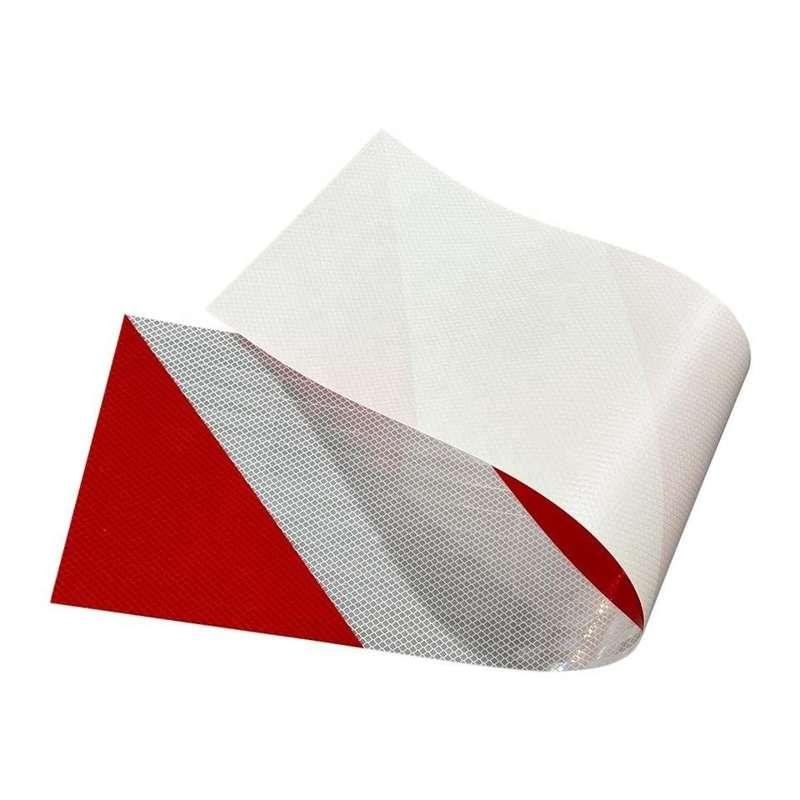 Flexible red and white reflective delineator film peeled from its release liner