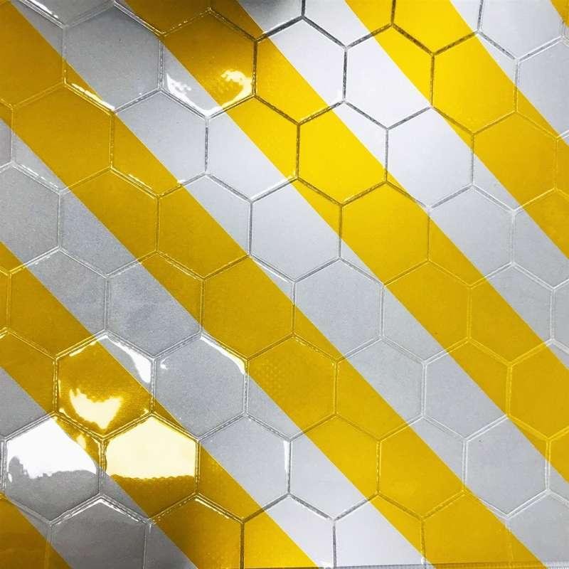 Close-up of yellow and white reflective tail lift flag surface