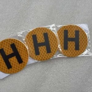 Yellow reflective H stickers in individual clear sleeves