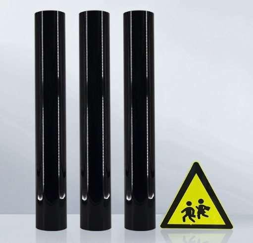 Black sign-making film rolls with an illustrated warning-sign graphic