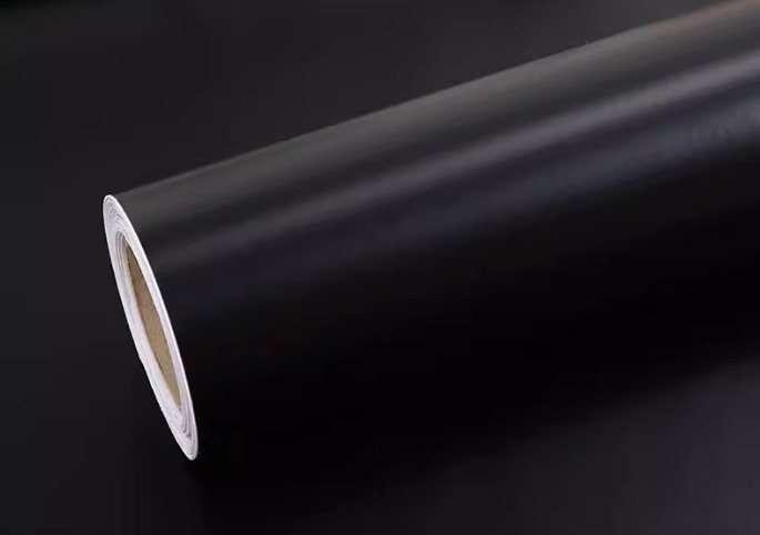 Black sign-making film with light-colored release liner