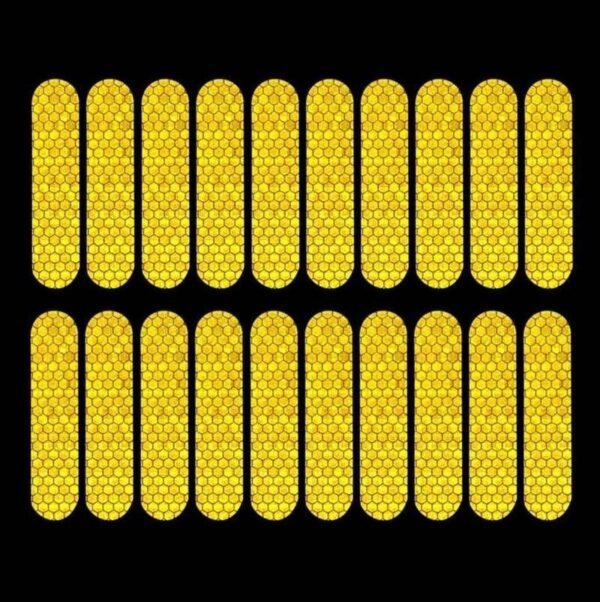 Twenty yellow reflective strips shown under directed illumination