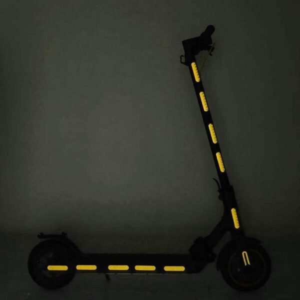 Yellow reflective strips applied to an electric scooter as an installation example