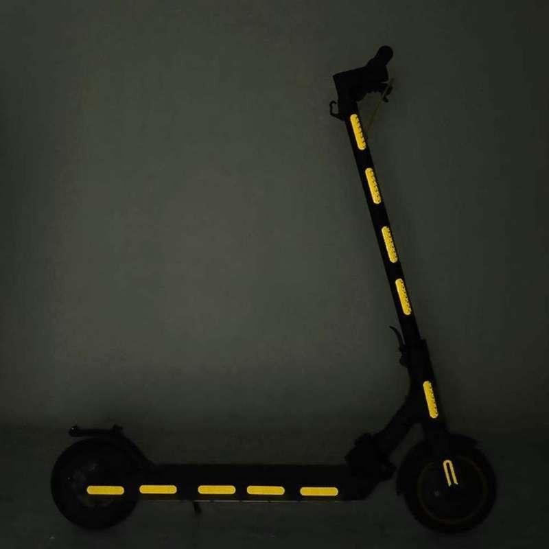 Yellow reflective strips applied to an electric scooter as an installation example
